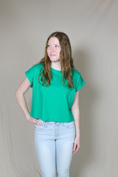 Green short sleeve crop top on model