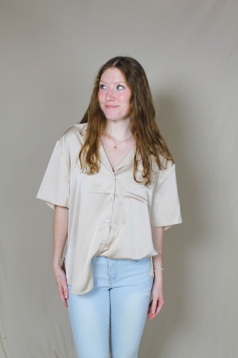 Champagne satin button-down blouse on model